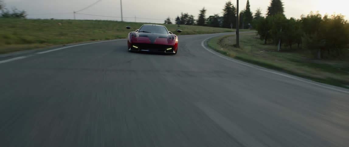 A person drives a fast sports car