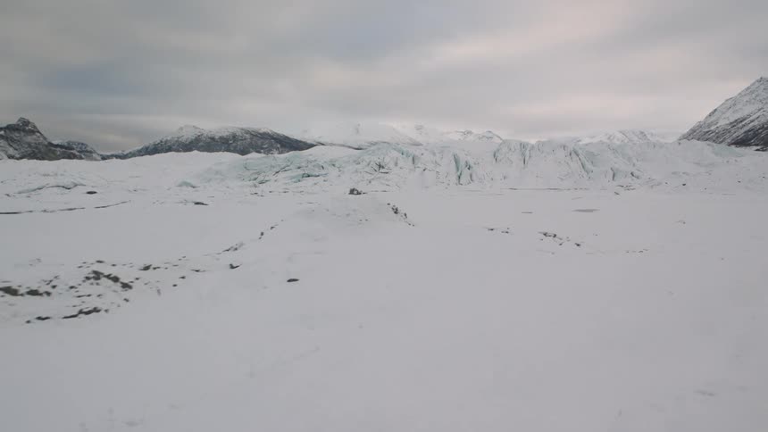 Traverse over a cold and barren landscape of snow and ice