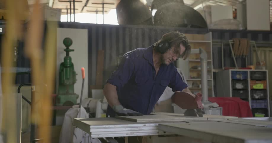 A man works in a wood workshop