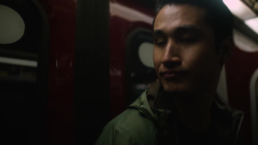 A man inside of a train at night