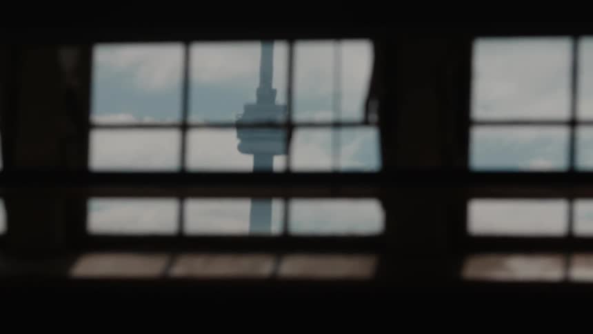 Looking out a window toward a pole