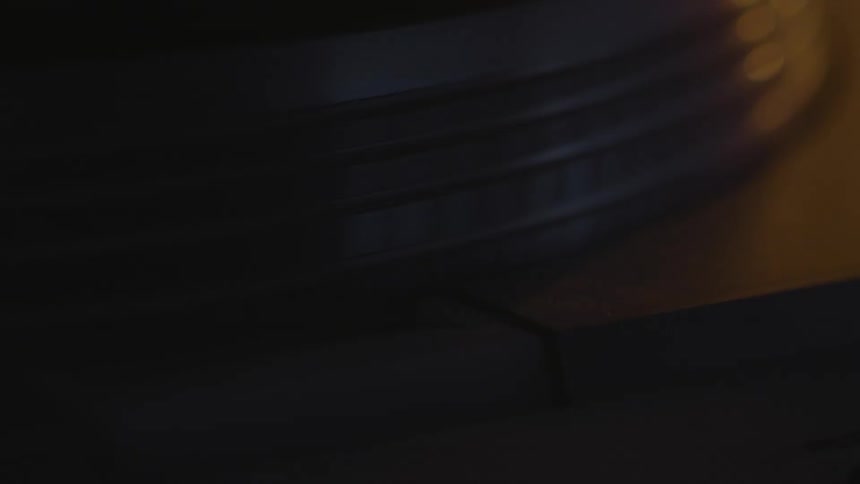 A record player lights up and spins