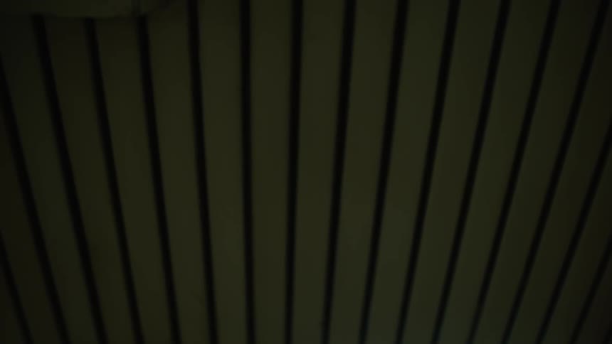 Fluorescent lights illuminate a hallway