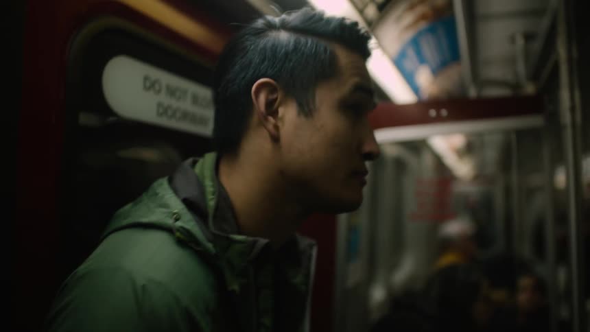 A man is riding the subway