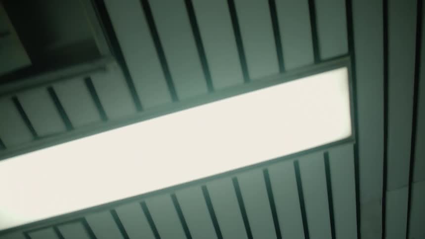 The ceiling has lights every few feet