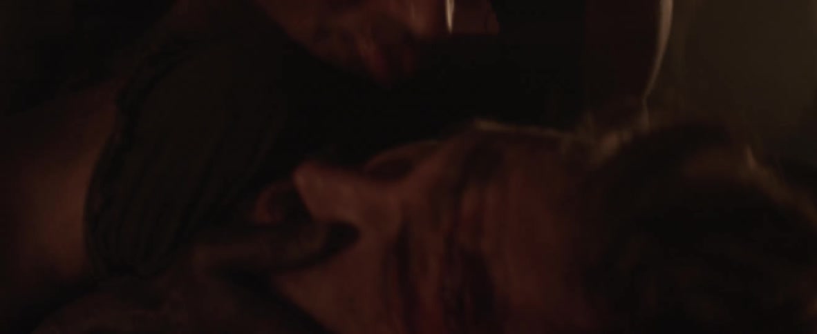 A man is choking a man and holding his head