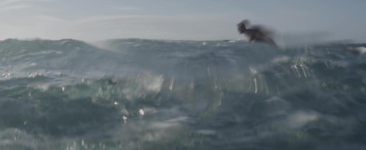 Man stays afloat in rough waters