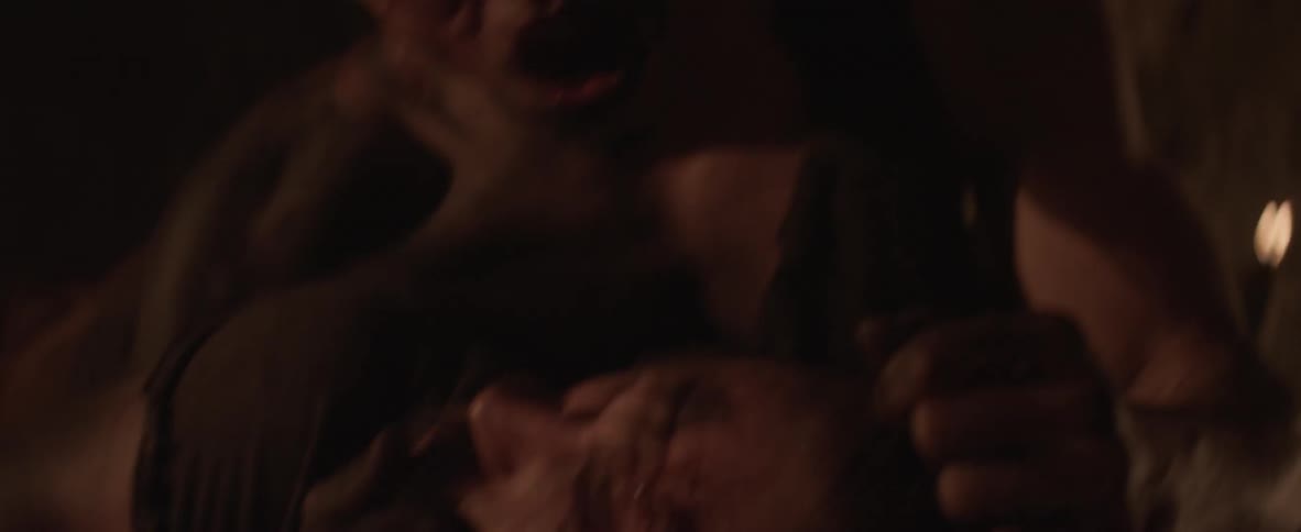 A man is holding a person on the ground as he is bleeding