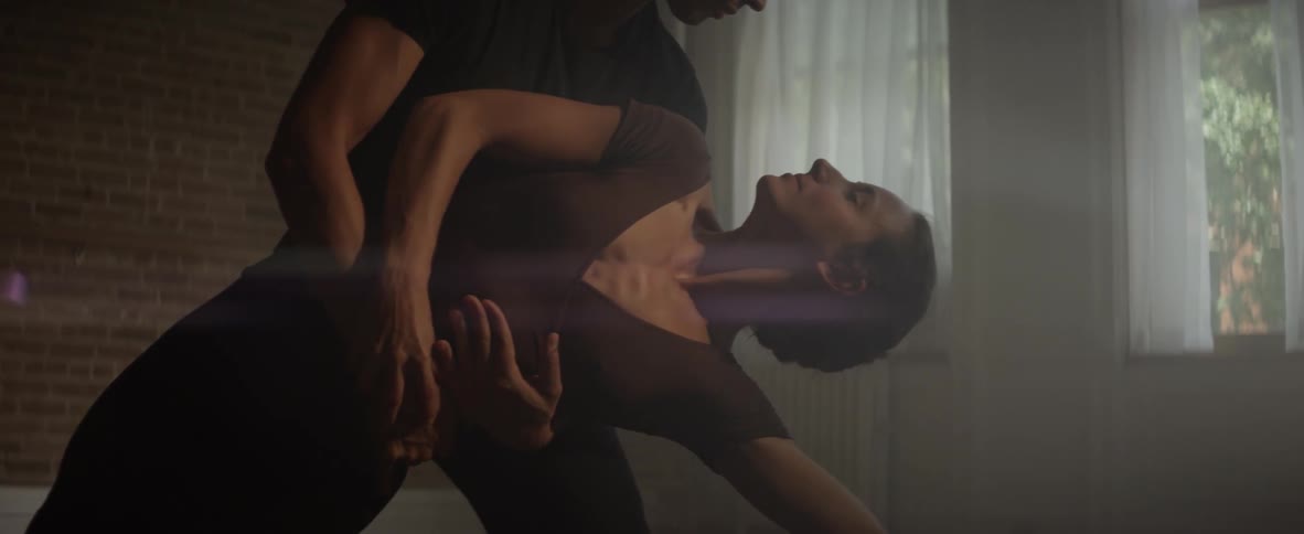 Man and woman dance in a studio