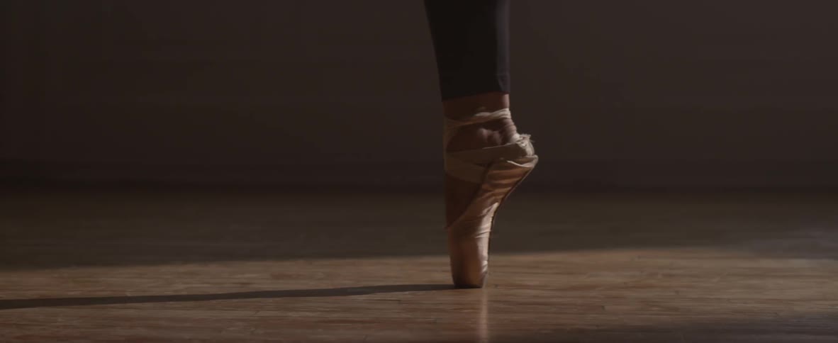 A dancer twirls on her toes