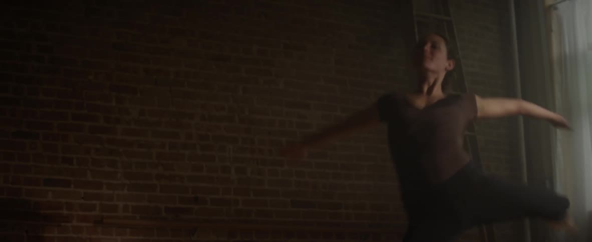 A ballerina does pirouettes and a leap