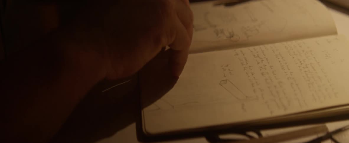 Person flips through pages of a notebook