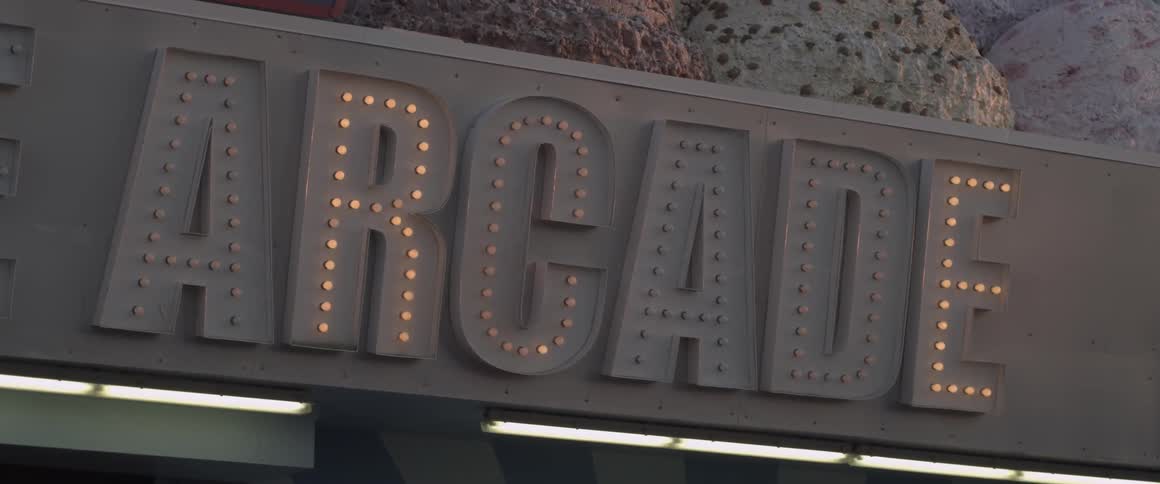 Lights flash on an arcade sign