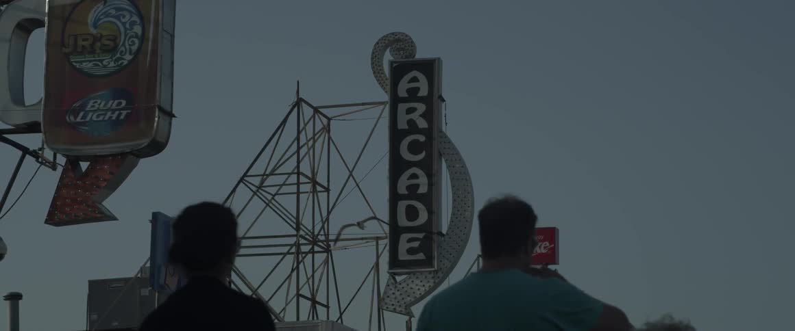 People walk towards an arcade