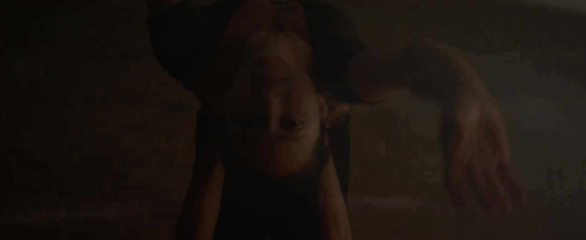 Woman dances in the dark