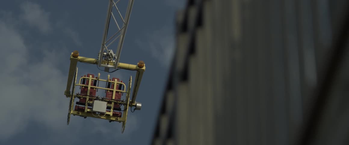 A ski lift is still in the sky