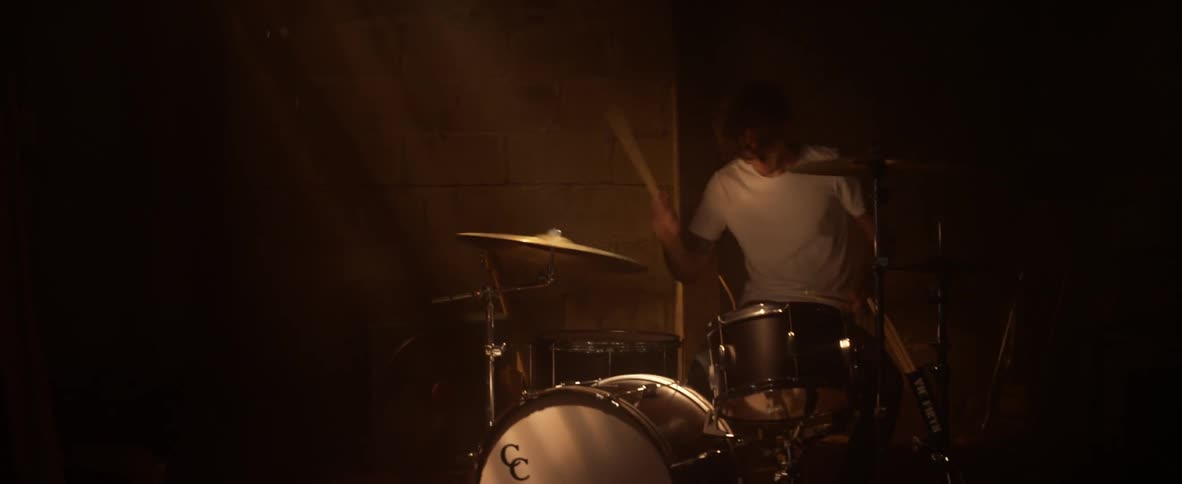 A man plays the drums