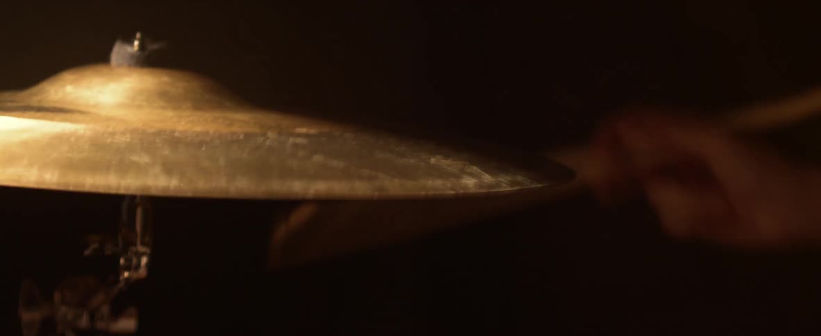 Someone hits a cymbal