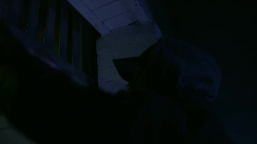 A man raises the gate on an elevator