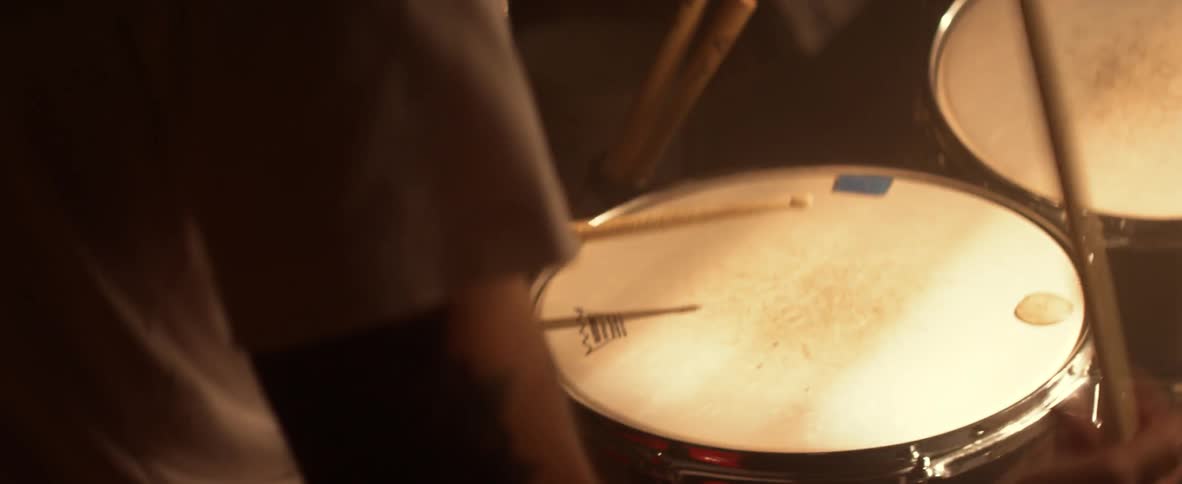 A man is playing drums