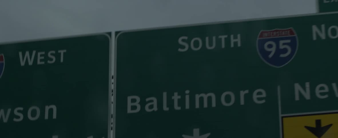The street signs give direction on the highway