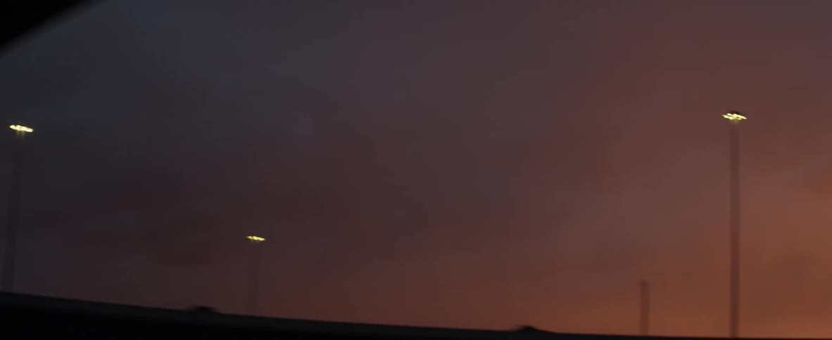 Cars driving along the highway at dawn