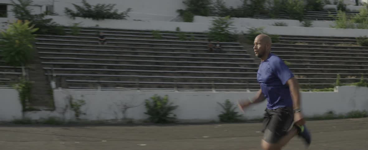 A man runs off racing on the field