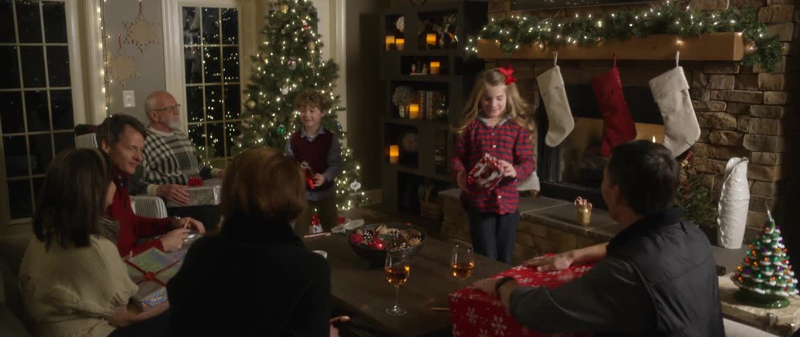 A family opens presents on christmas