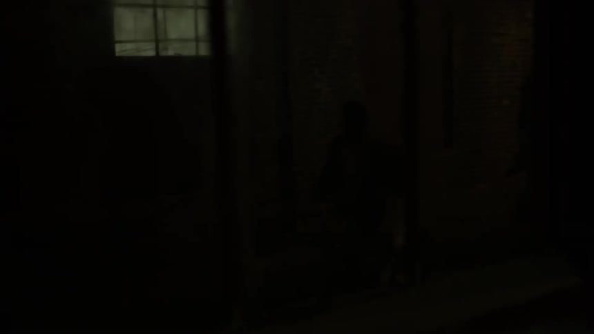 People run in a dark abandoned building