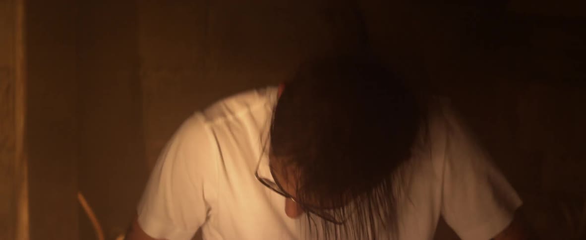 A man is playing drums furiously