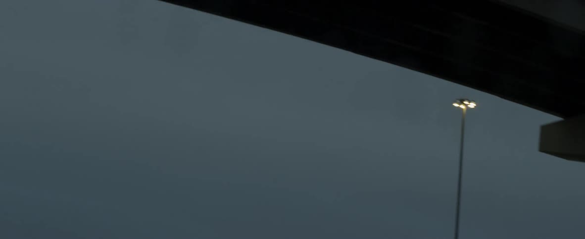 Traveling under freeway overpasses at dusk