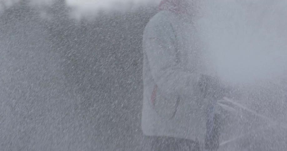 Man spraying water from a hose