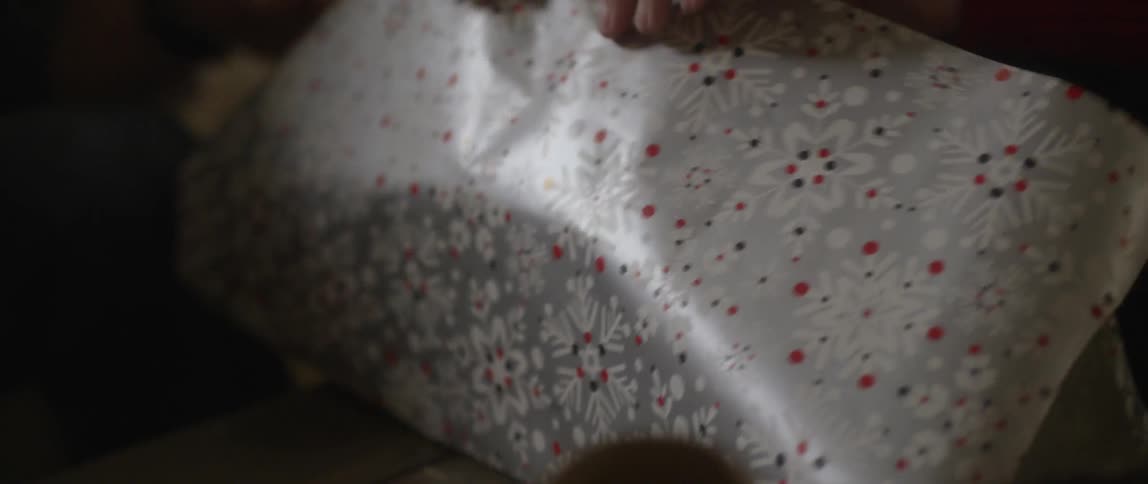 A person wrapping presents