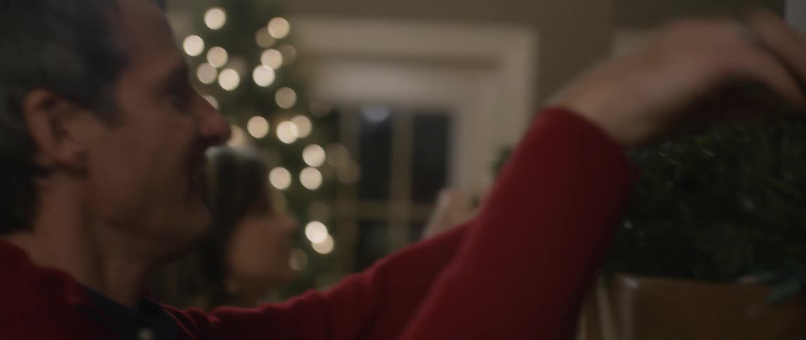 Family putting up decorations in a home