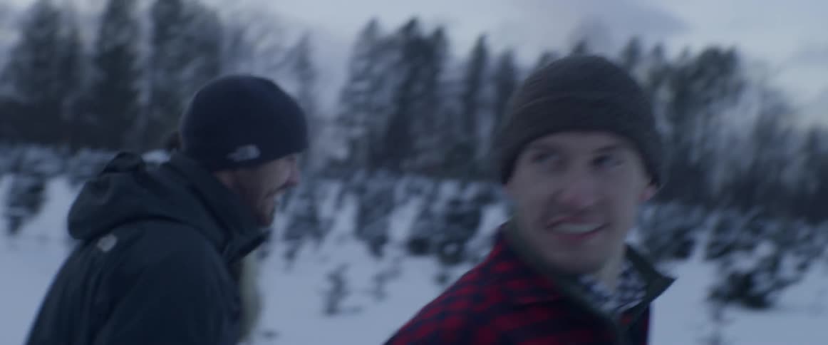 Three people walking through a snowy area