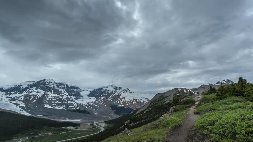 View of a mountain range with heavy clouds above