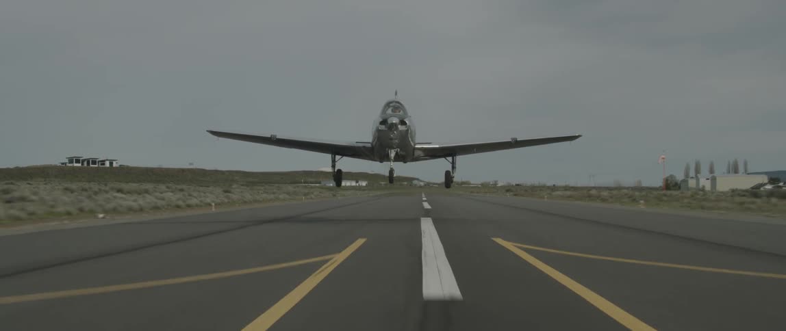 A small airplane lifts off of the runway