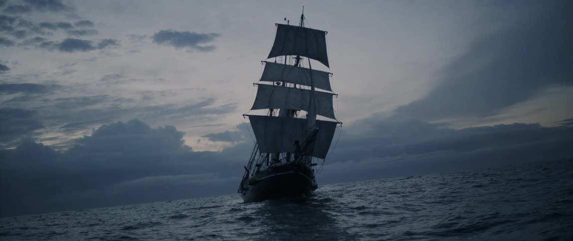 A boat slowly moves in the water