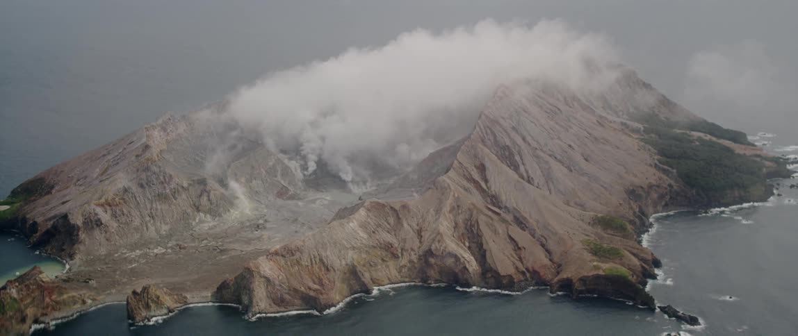 Clouds move slowly over the mountains of the island