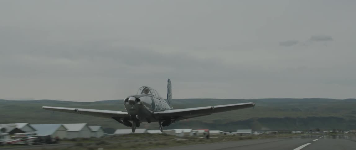 A plane takes off on a cloudy day