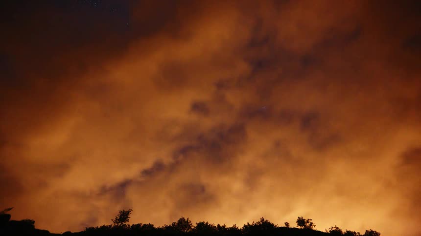 Time lapse video of clouds being illuminated by the sun