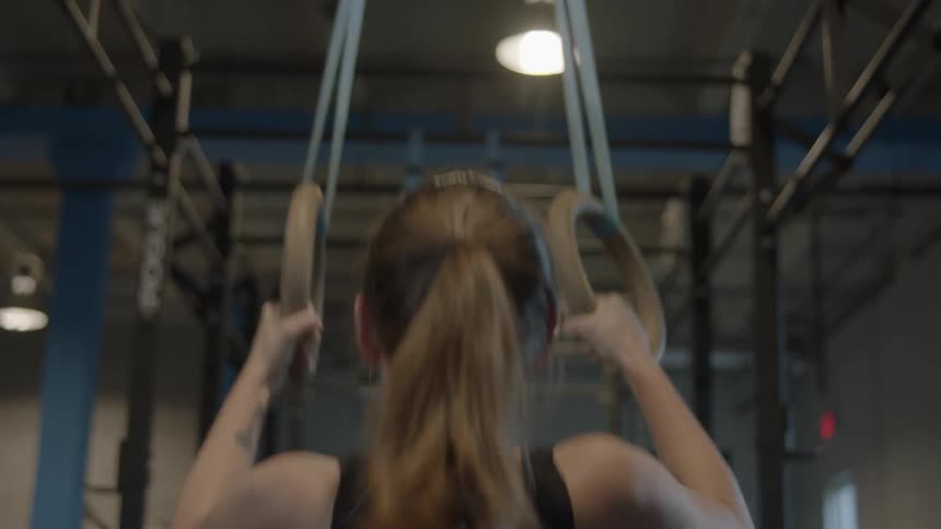 A gymnast performs exercises with rings