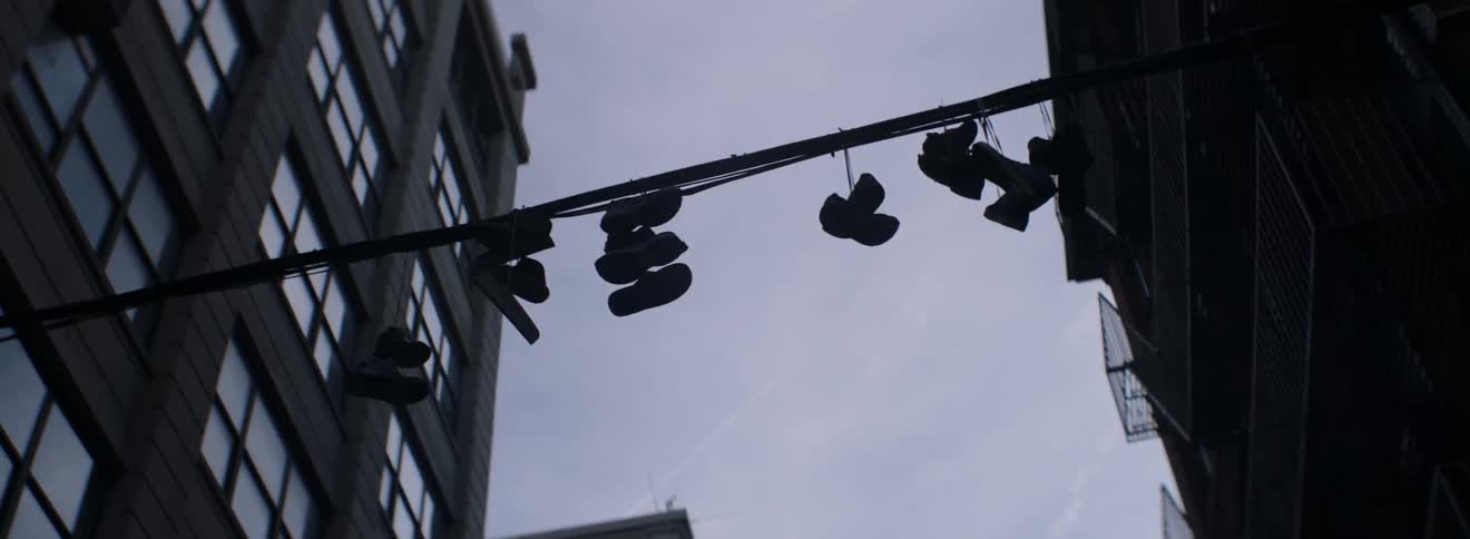 Shoes hang from a power line in the city