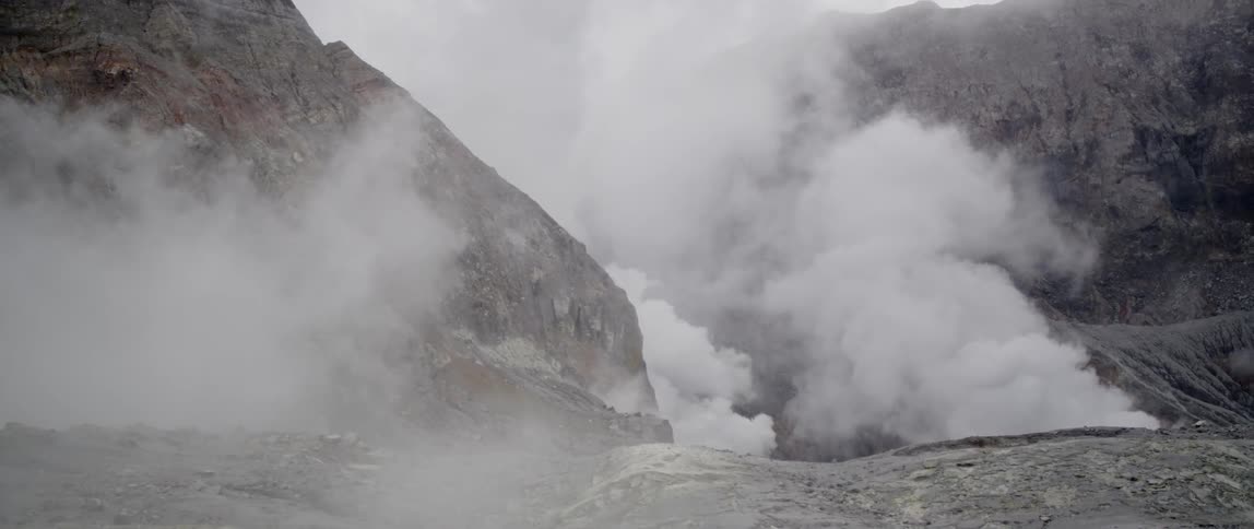 The mountain pass is covered with smoke