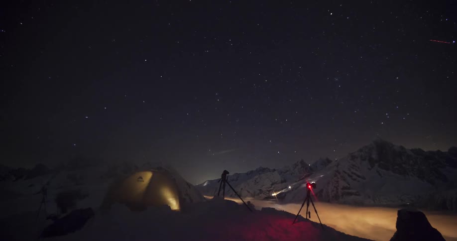 Timelapse video of people camping on top of a mountain