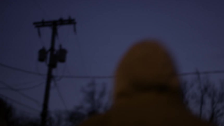 Person walking outside at night