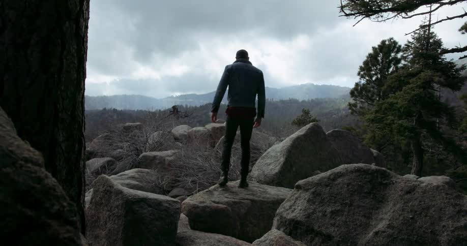 A man hikes along a mountain