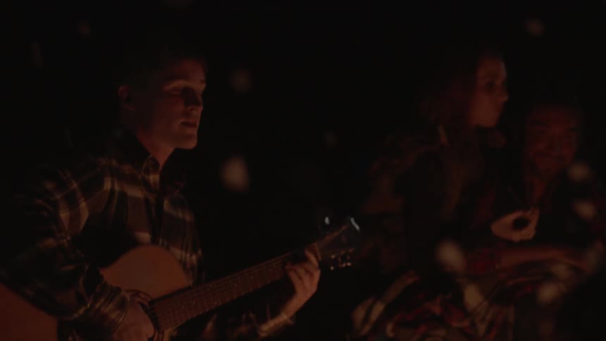 A person is playing the guitar