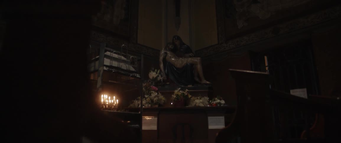 Candles are lit in this dark room