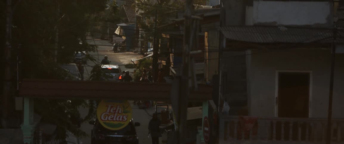 Cars drive on a city road